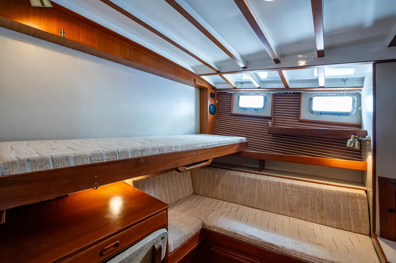 Slide: The Image of Cozy cabin interior of 1993 Kadey-Krogen Krogen 42 yacht with wooden accents and bunk beds. - 17