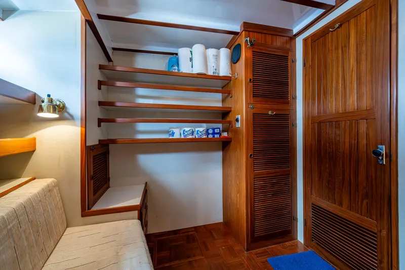 Slide: The Image of Interior of 1993 Kadey-Krogen Krogen 42 with wooden shelves and storage. - 18