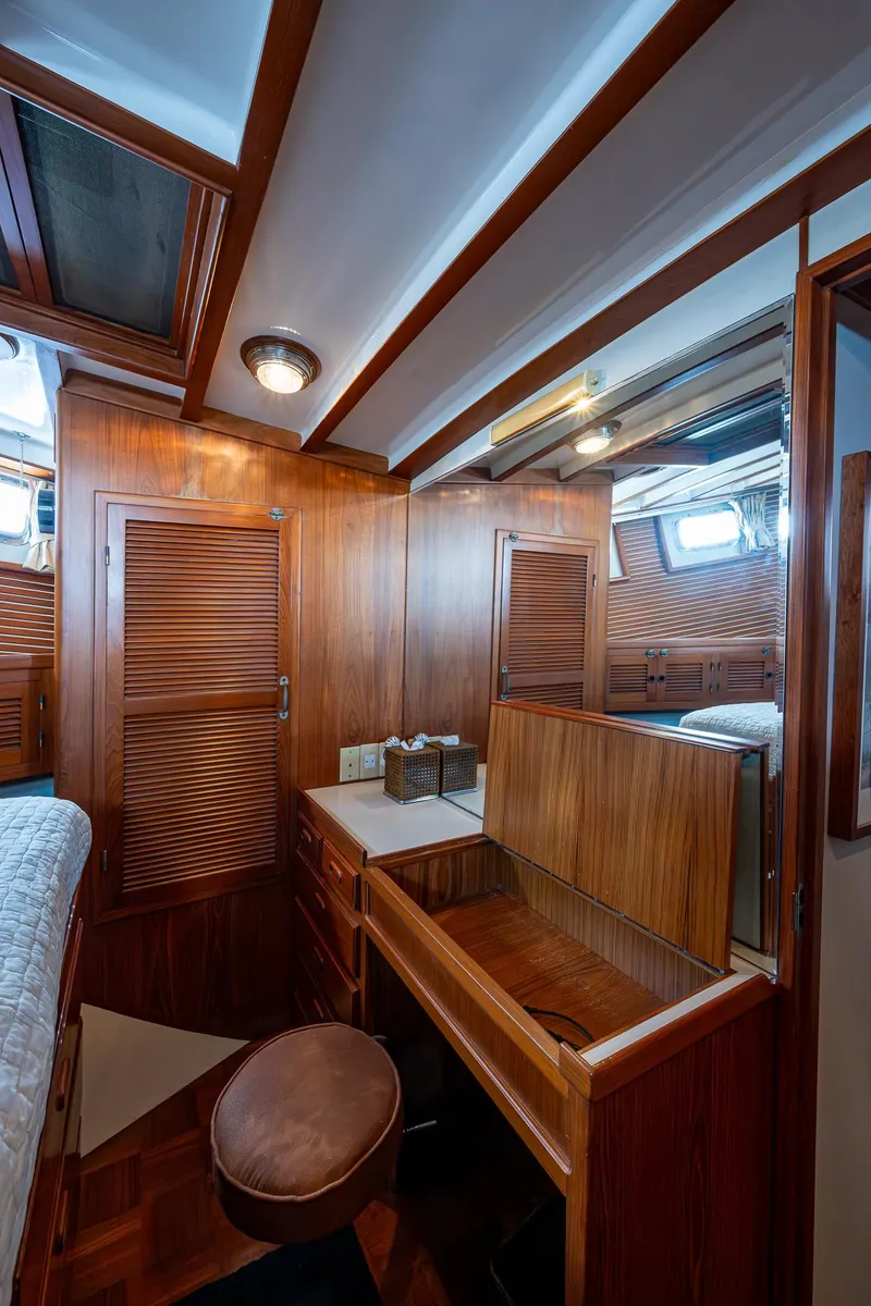 Slide: The Image of 1993 Kadey-Krogen Krogen 42 yacht interior with wooden cabinetry and vanity area. - 24