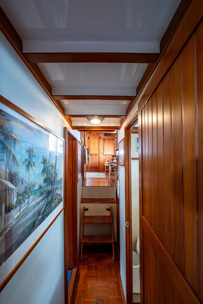 Slide: The Image of Interior hallway of 1993 Kadey-Krogen Krogen 42 yacht with wooden paneling and artwork. - 27