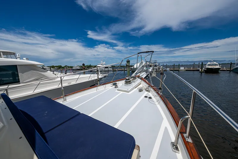 Slide: The Image of 1993 Kadey-Krogen Krogen 42 yacht docked at marina under blue sky. - 39