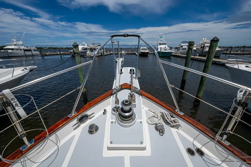 Slide: The Image of Bow view of 1993 Kadey-Krogen Krogen 42 yacht docked in a marina. - 40