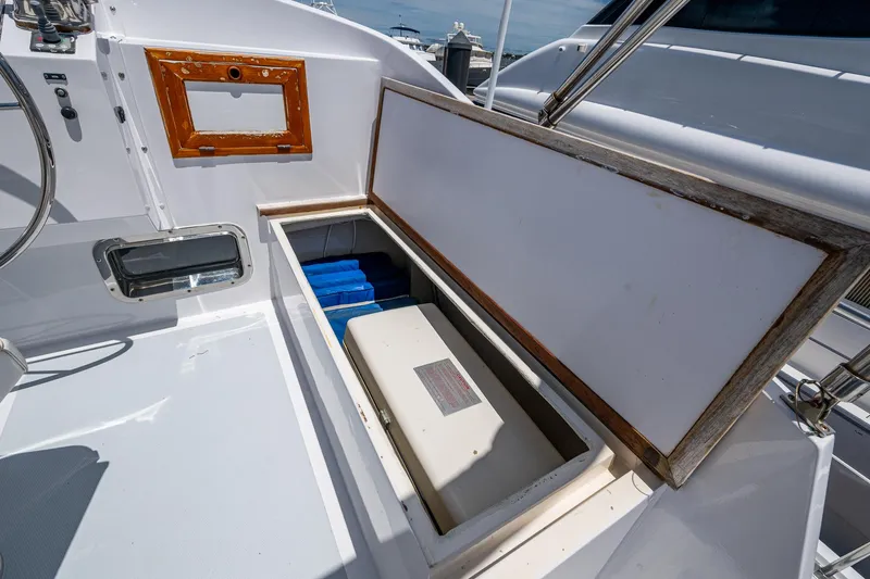 Slide: The Image of Open storage compartment on 1993 Kadey-Krogen Krogen 42 boat deck. - 43