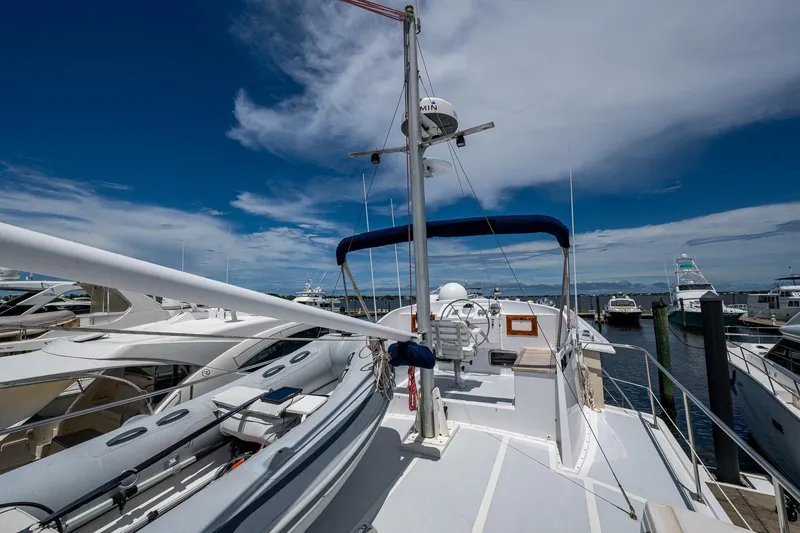 Slide: The Image of Kadey-Krogen Krogen 42 yacht, 1993 model, docked under a clear blue sky. - 48