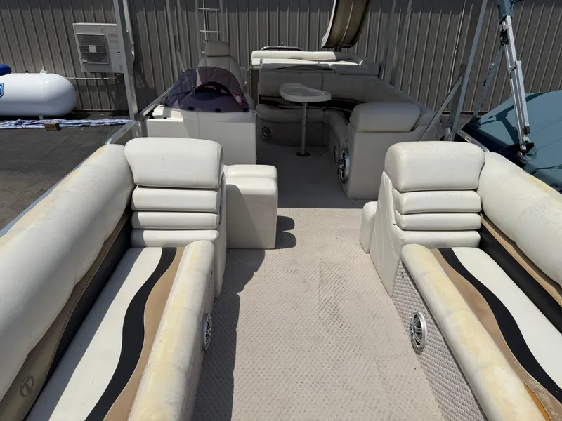 Slide: The Image of 2011 Tahoe Pontoon Double Decker with spacious seating and table, ideal for leisure. - 11