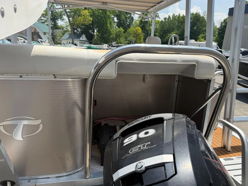 Slide: The Image of 2011 Tahoe Pontoon Double Decker with Mercury 90 GT engine, docked outdoors. - 4