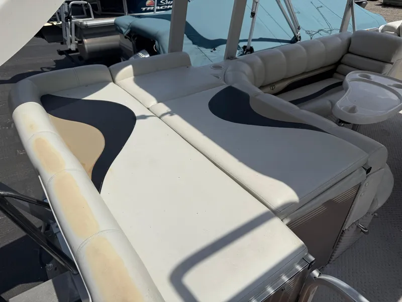 Slide: The Image of 2011 Tahoe Pontoon Double Decker with cushioned seating and table on deck. - 7