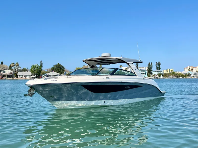 Slide: The Image of 2022 Sea Ray SLX 400 OB luxury boat on calm waters. - 2