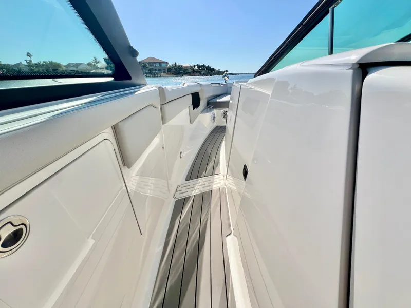Slide: The Image of 2022 Sea Ray SLX 400 OB boat deck with sleek design and ocean view. - 23