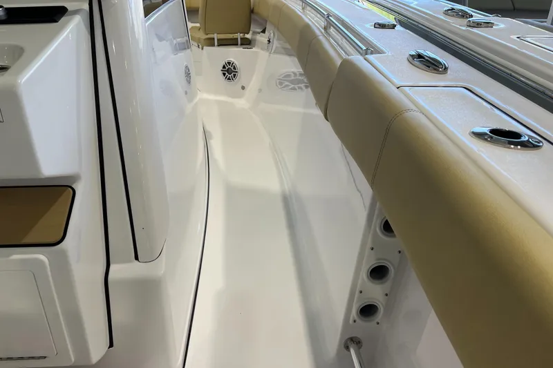Slide: The Image of 2025 Sportsman Open 352 Center Console interior with beige seating and sleek design. - 12