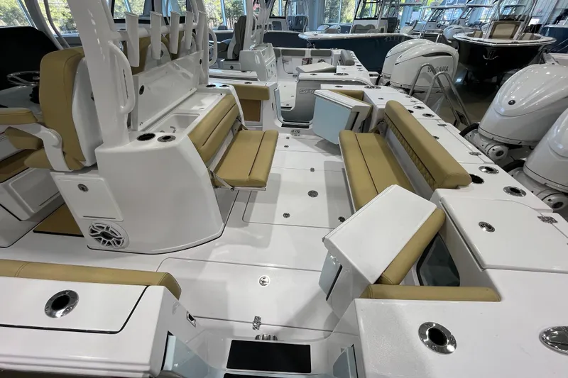 Slide: The Image of 2025 Sportsman Open 352 Center Console boat interior with tan seating and white deck. - 16