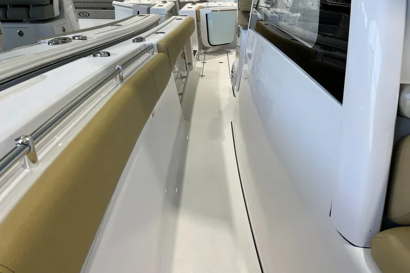Slide: The Image of 2025 Sportsman Open 352 Center Console boat interior with sleek design and cushioned seating. - 17