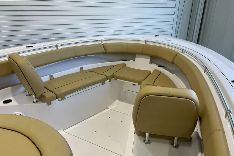 Slide: The Image of 2025 Sportsman Open 352 Center Console boat with tan cushioned seating and sleek design. - 3