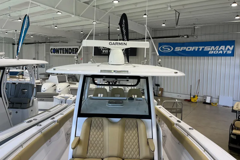 Slide: The Image of 2025 Sportsman Open 352 Center Console boat in showroom with Garmin equipment. - 5