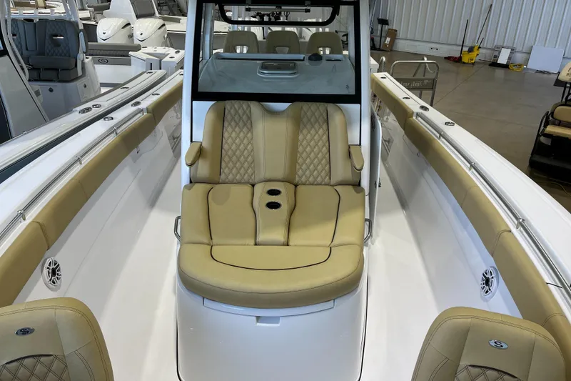Slide: The Image of 2025 Sportsman Open 352 Center Console boat interior with tan seating and modern design. - 6