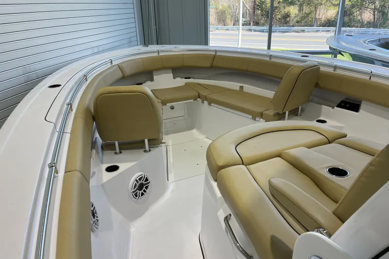 Slide: The Image of 2025 Sportsman Open 352 Center Console boat interior with tan seating and cup holders. - 8