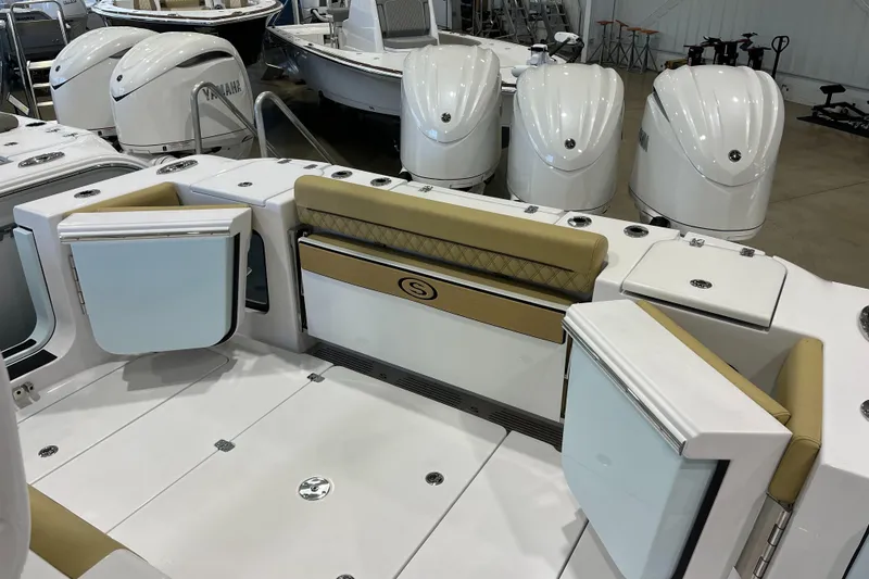 Slide: The Image of 2025 Sportsman Open 352 Center Console boat interior with seating and storage compartments. - 9