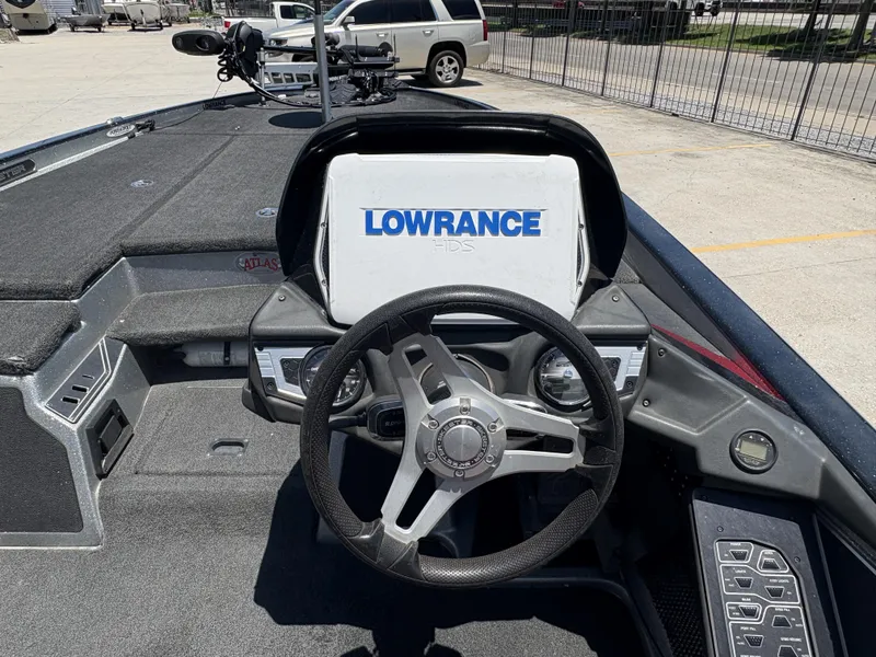 Slide: The Image of 2018 Skeeter FX 21 boat dashboard with Lowrance HDS system and steering wheel. - 10