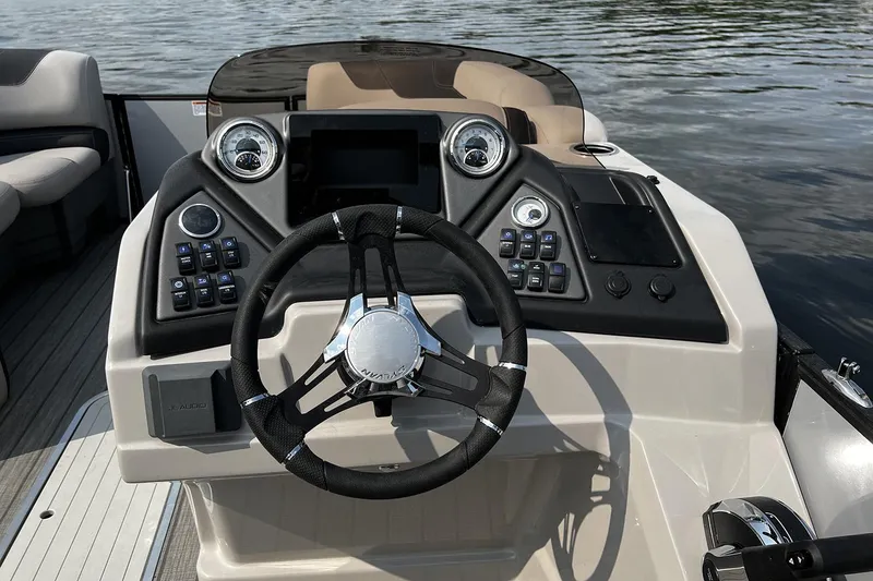 Slide: The Image of 2026 Sylvan L3 RLZ pontoon boat with sleek blue design and comfortable seating. - 6