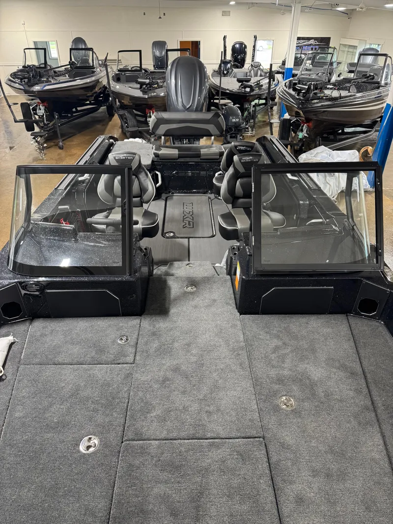 Slide: The Image of 2025 Skeeter WXR 2260 boat interior with seating and windshield in showroom. - 16