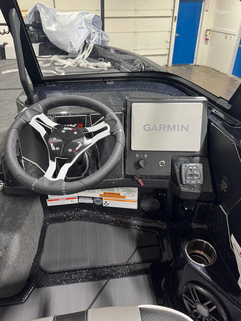 Slide: The Image of 2025 Skeeter WXR 2260 boat dashboard with Garmin navigation system. - 9