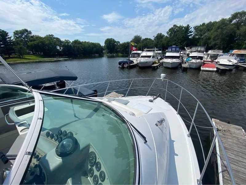 Slide: The Image of 1999 Carver 350 Mariner yacht docked at a marina with other boats. - 20