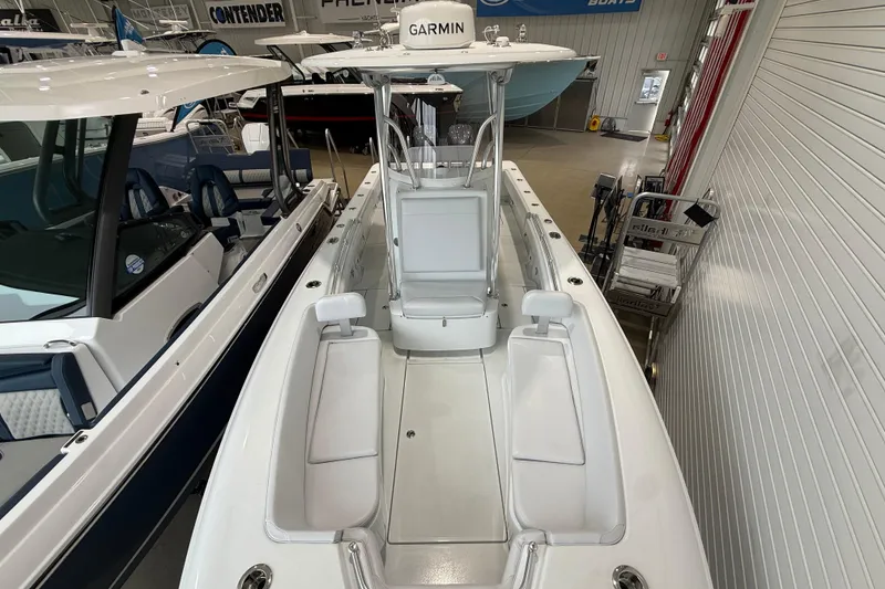 Slide: The Image of 2026 Contender 25 Tournament boat interior with Garmin equipment in showroom. - 14