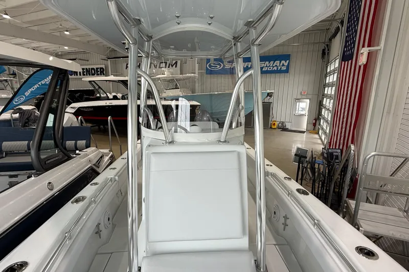 Slide: The Image of 2026 Contender 25 Tournament boat interior in showroom with American flag. - 16