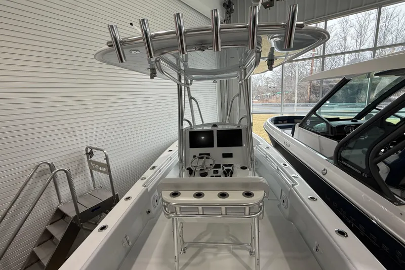 Slide: The Image of 2026 Contender 25 Tournament boat interior with modern helm and rod holders. - 18