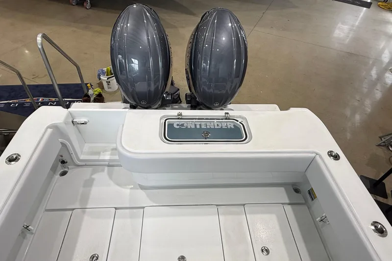 Slide: The Image of 2026 Contender 25 Tournament boat with dual engines, viewed from the rear deck. - 21