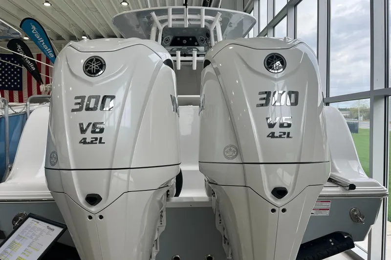 Slide: The Image of Twin Yamaha 300 V6 4.2L engines on a 2025 Sportsman Open 302 Center Console boat. - 2