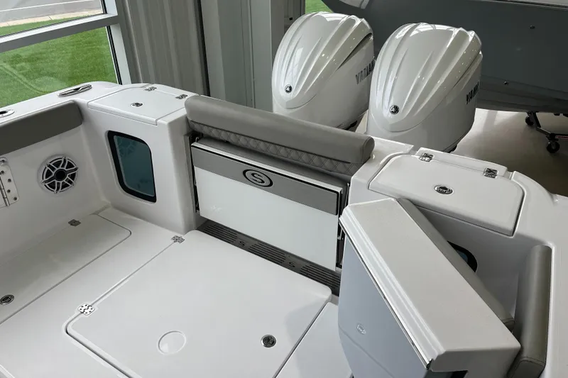 Slide: The Image of 2025 Sportsman Open 302 Center Console boat interior with dual Yamaha engines. - 4