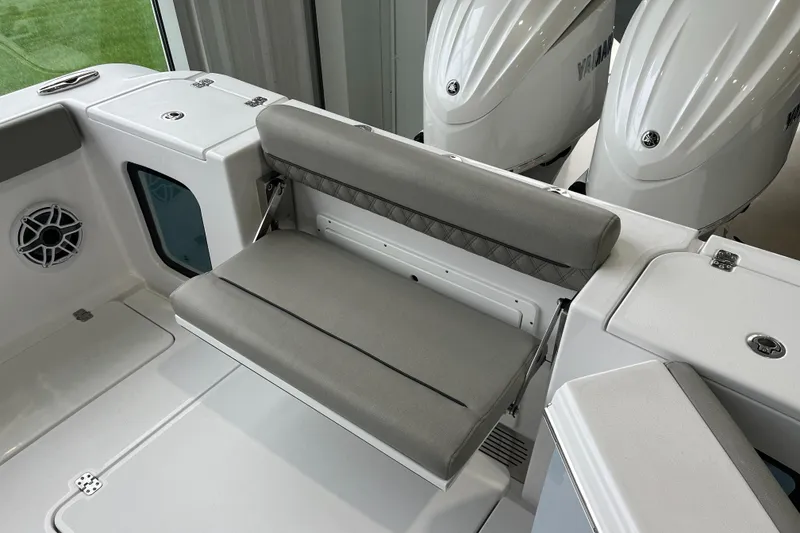 Slide: The Image of 2025 Sportsman Open 302 Center Console boat with foldable seating and dual engines. - 5