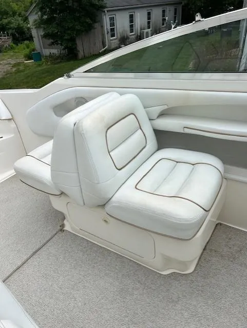 Slide: The Image of White leather seating on a 1998 Sea Ray 28 CC boat, showcasing luxury and comfort. - 13