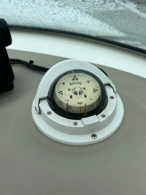 Slide: The Image of Compass on 1998 Sea Ray 28 CC boat dashboard, showing Ritchie brand. - 23