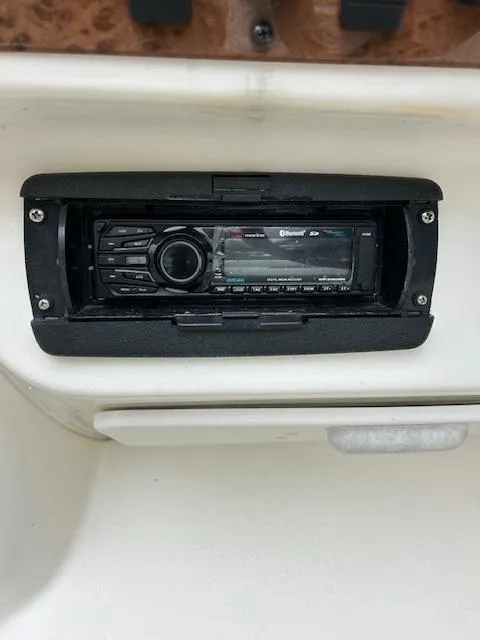 Slide: The Image of Boat stereo system on a 1998 Sea Ray 28 CC dashboard. - 25