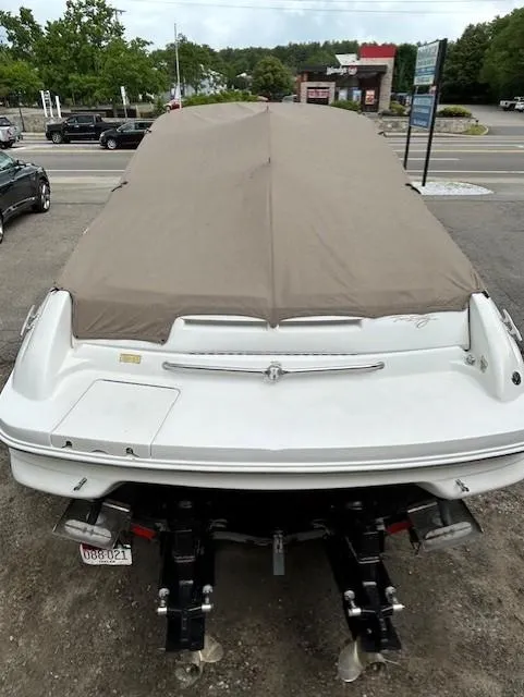 Slide: The Image of Covered 1998 Sea Ray 28 CC boat on trailer, parked in a lot. - 5