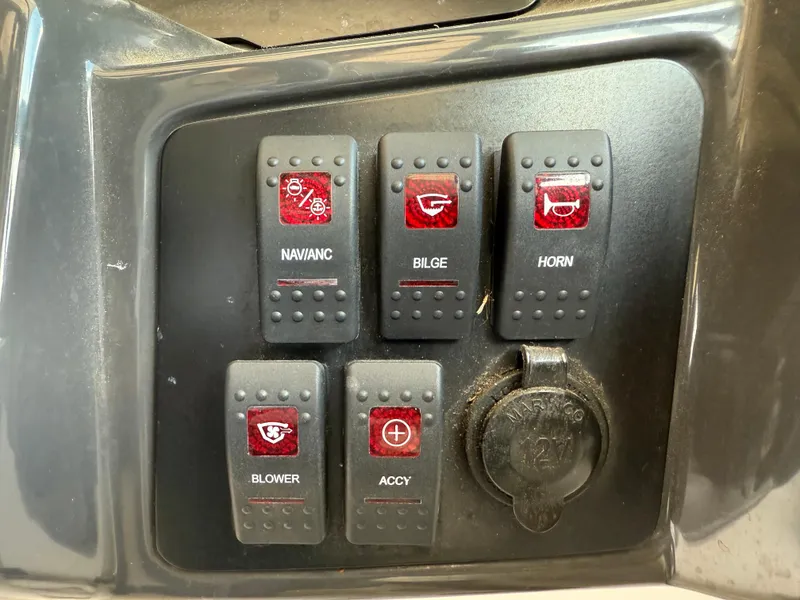 Slide: The Image of Control panel of a 2016 Monterey 196MS boat with labeled switches. - 12