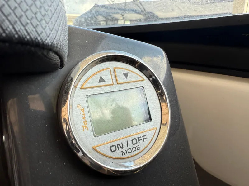 Slide: The Image of Control panel of a 2016 Monterey 196MS boat with digital display and buttons. - 16