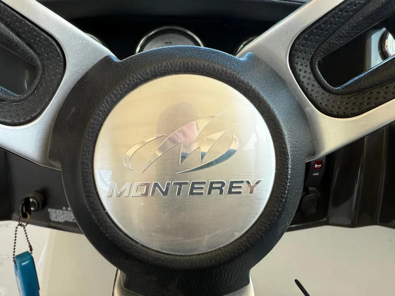 Slide: The Image of Steering wheel of a 2016 Monterey 196MS boat, featuring the brand logo prominently. - 17