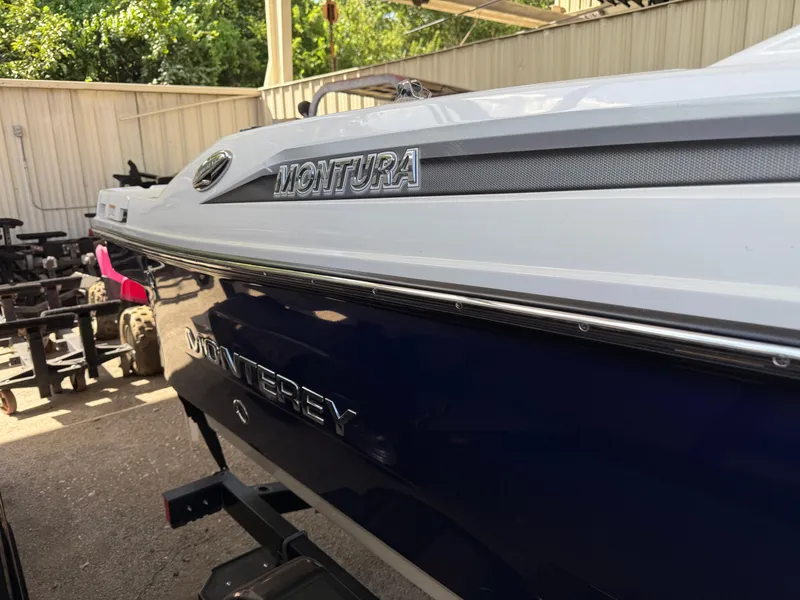 Slide: The Image of 2016 Monterey 196MS boat in storage, showcasing sleek design and branding. - 7