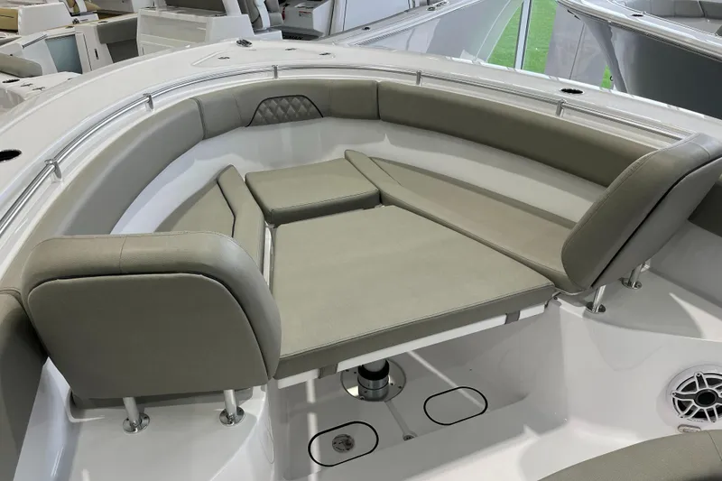 Slide: The Image of 2025 Sportsman Open 282 Center Console boat with cushioned seating area. - 11