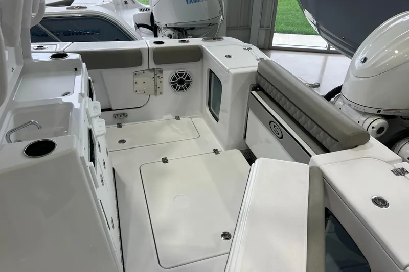 Slide: The Image of 2025 Sportsman Open 282 Center Console boat interior with seating and storage. - 13