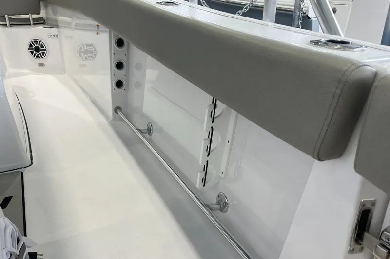 Slide: The Image of 2025 Sportsman Open 282 Center Console interior with seating and rod holders. - 19