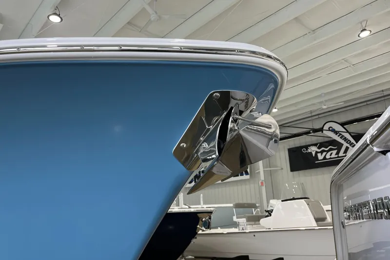 Slide: The Image of 2025 Sportsman Open 282 Center Console boat with blue hull and stainless steel anchor. - 20