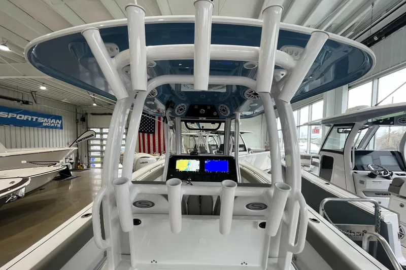 Slide: The Image of 2025 Sportsman Open 282 Center Console boat interior with navigation display and rod holders. - 6
