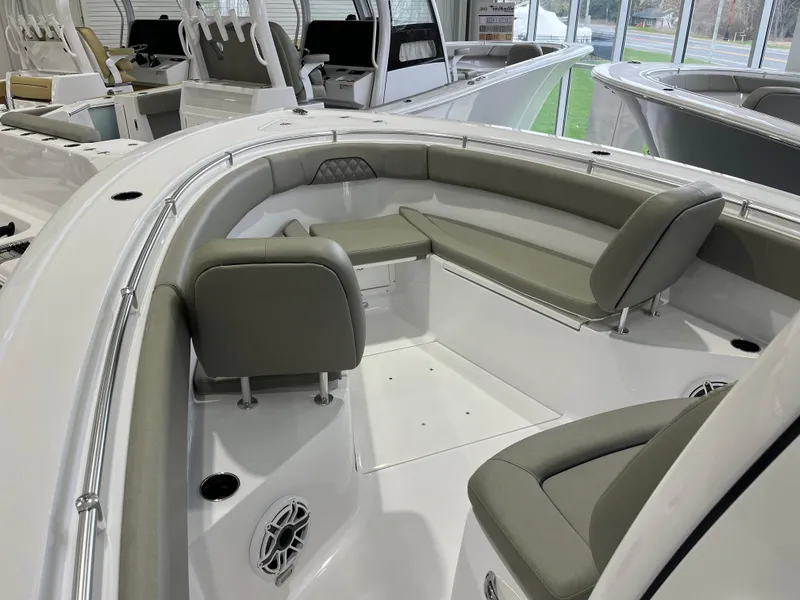 Slide: The Image of 2025 Sportsman Open 282 Center Console boat interior with gray seating and modern design. - 8