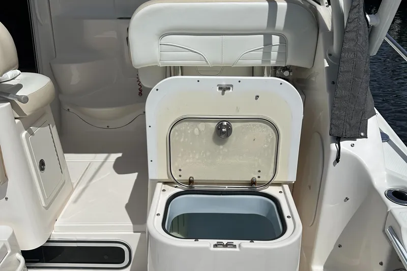 Slide: The Image of Open storage compartment on 2015 Wellcraft 290 Coastal boat interior. - 5