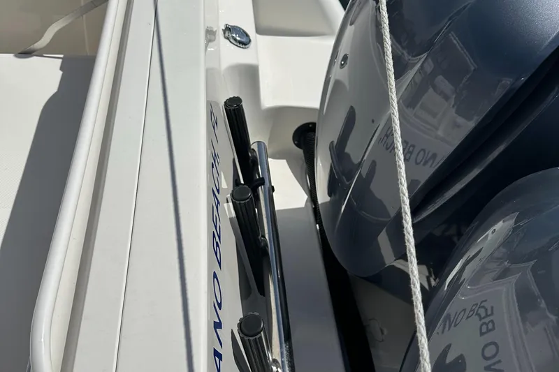 Slide: The Image of 2015 Wellcraft 290 Coastal boat with dual engines and sleek design. - 8