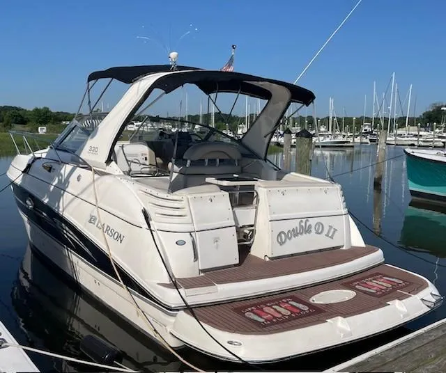 The Image of 2008 Larson Cabrio 330 Day Cruiser docked at marina, rear view. - 0